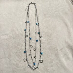 White House Black Market necklace with blue beads and silver pendants